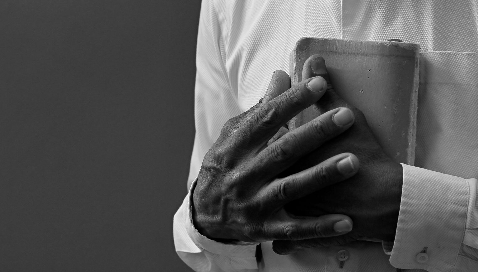 Hands holding a Bible